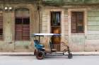 Cuba, Cienfuegos. Tuk Tuk, small wheeled cart transportation. Art Print